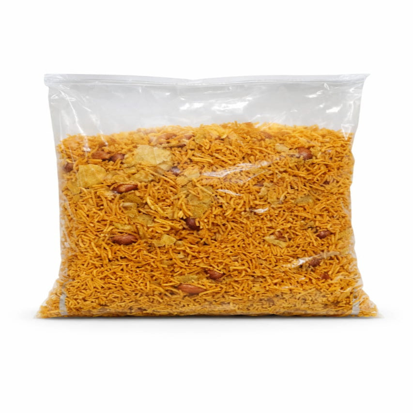 Clear plastic bag filled with yellow noodles on a white background