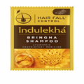 Indulekha Bringha Shampoo packet for hair fall control on a white background