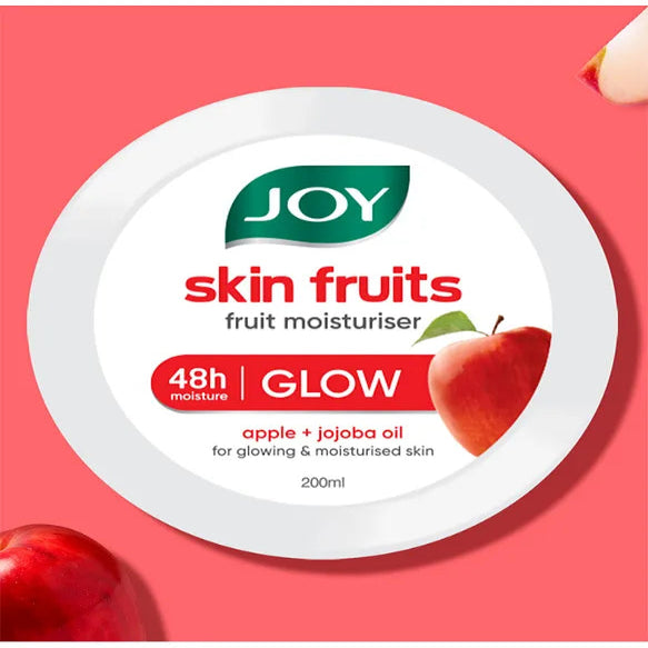JOY skin fruits fruit moisturizer container with apples on a pink background