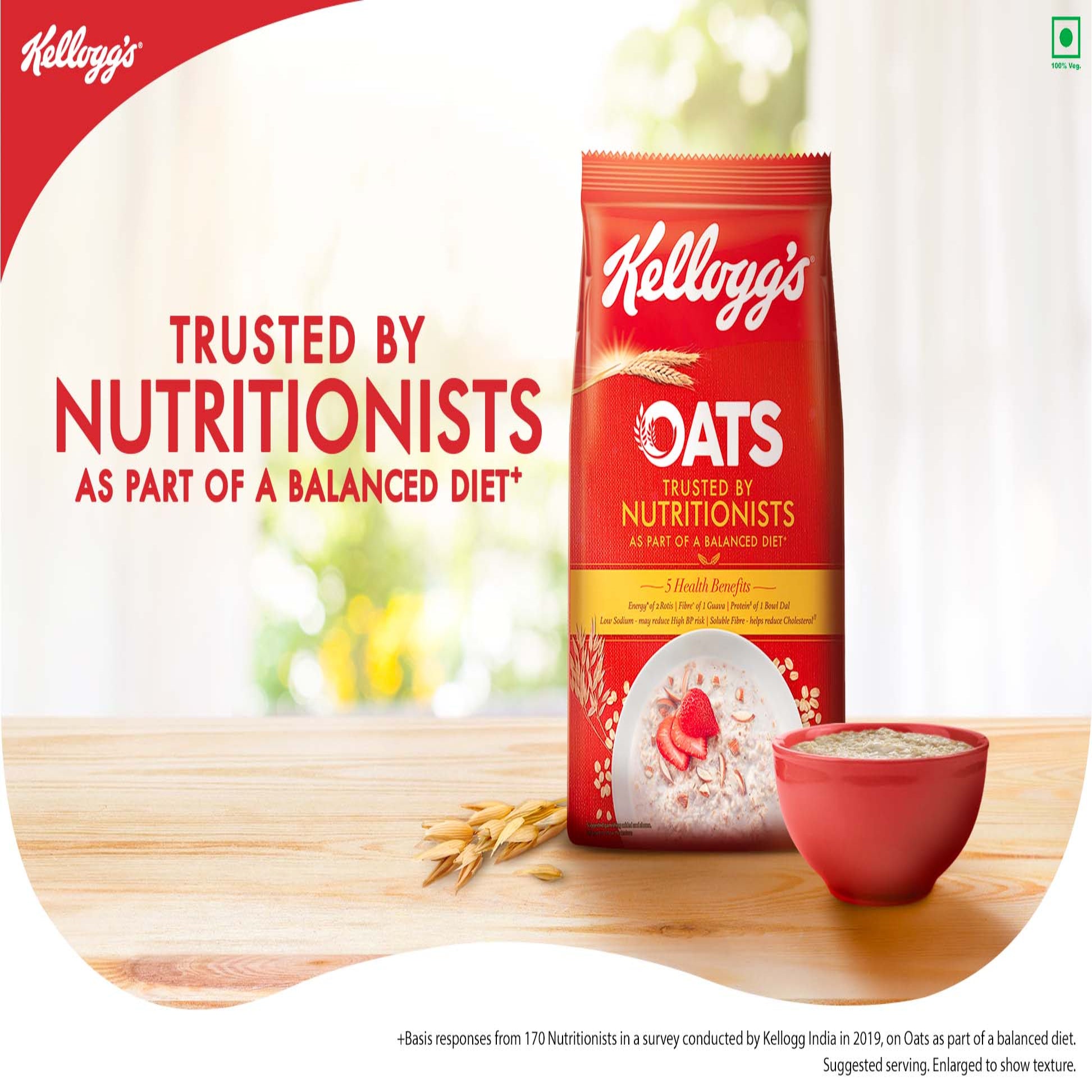 Kellogg's Oats package on a wooden surface with a bowl of oats and text about nutritionists' trust.