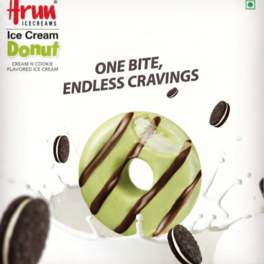 Green ice cream donut with chocolate drizzle on Arun Ice Creams packaging.